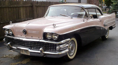 A 1956 Buick century eye seering hot pink primer with white pearl top
